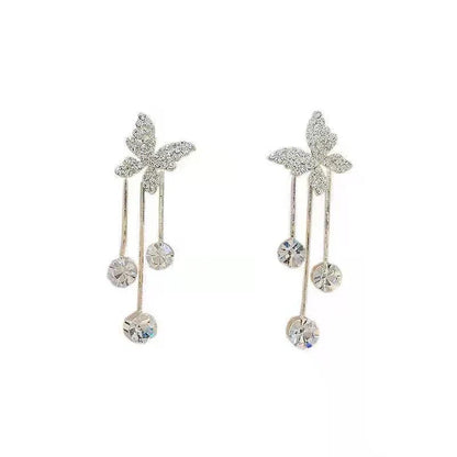 Shiny butterfly rhinestone earrings with pearl tassel, elegant, long dangle.