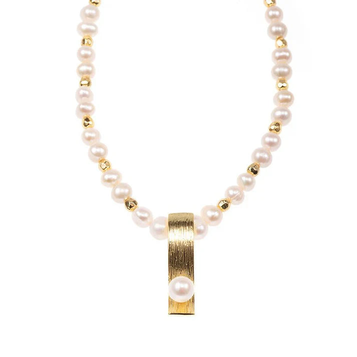Pearl necklace with minority-inspired fashion pendant, elegant for women.