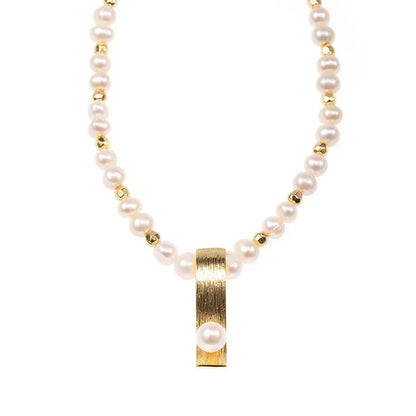Pearl necklace with minority-inspired fashion pendant, elegant for women.
