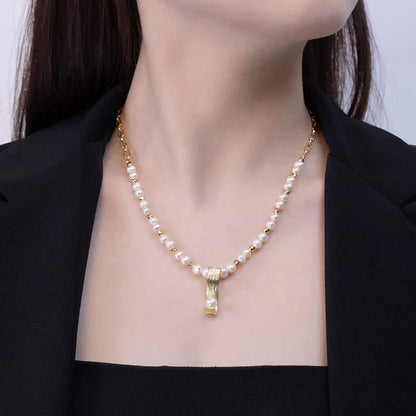 Pearl necklace with minority-inspired fashion pendant, elegant for women.